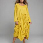 Rochie midi galbena cu design asimetric si detalii drapate