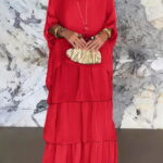 Rochie lunga suprapusa din matase si vascoza, cu trei volane mari si maneca cazuta, fucsia